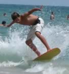 surfer surfing waves at deerfield beach